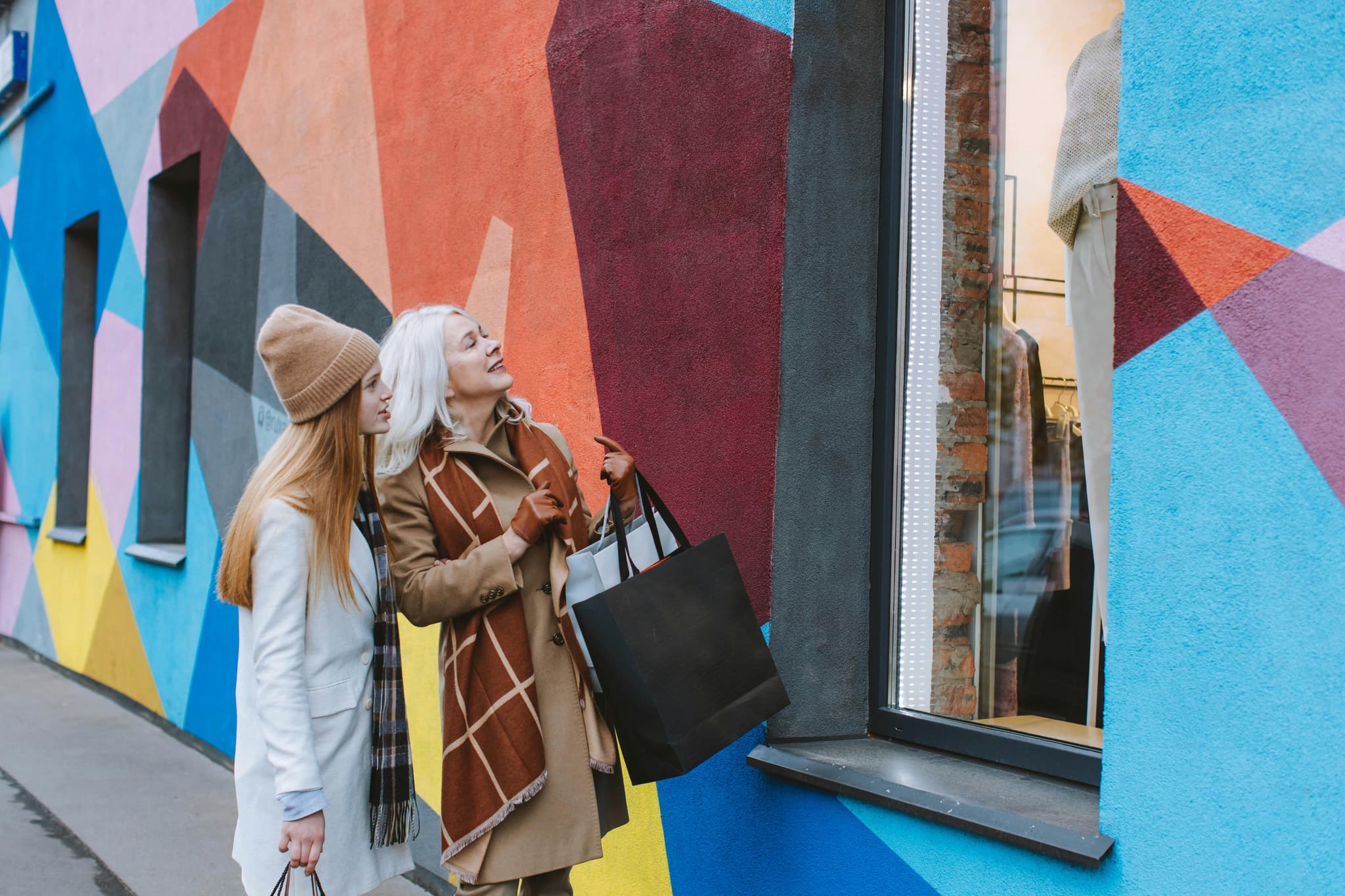 Two women looking out a window