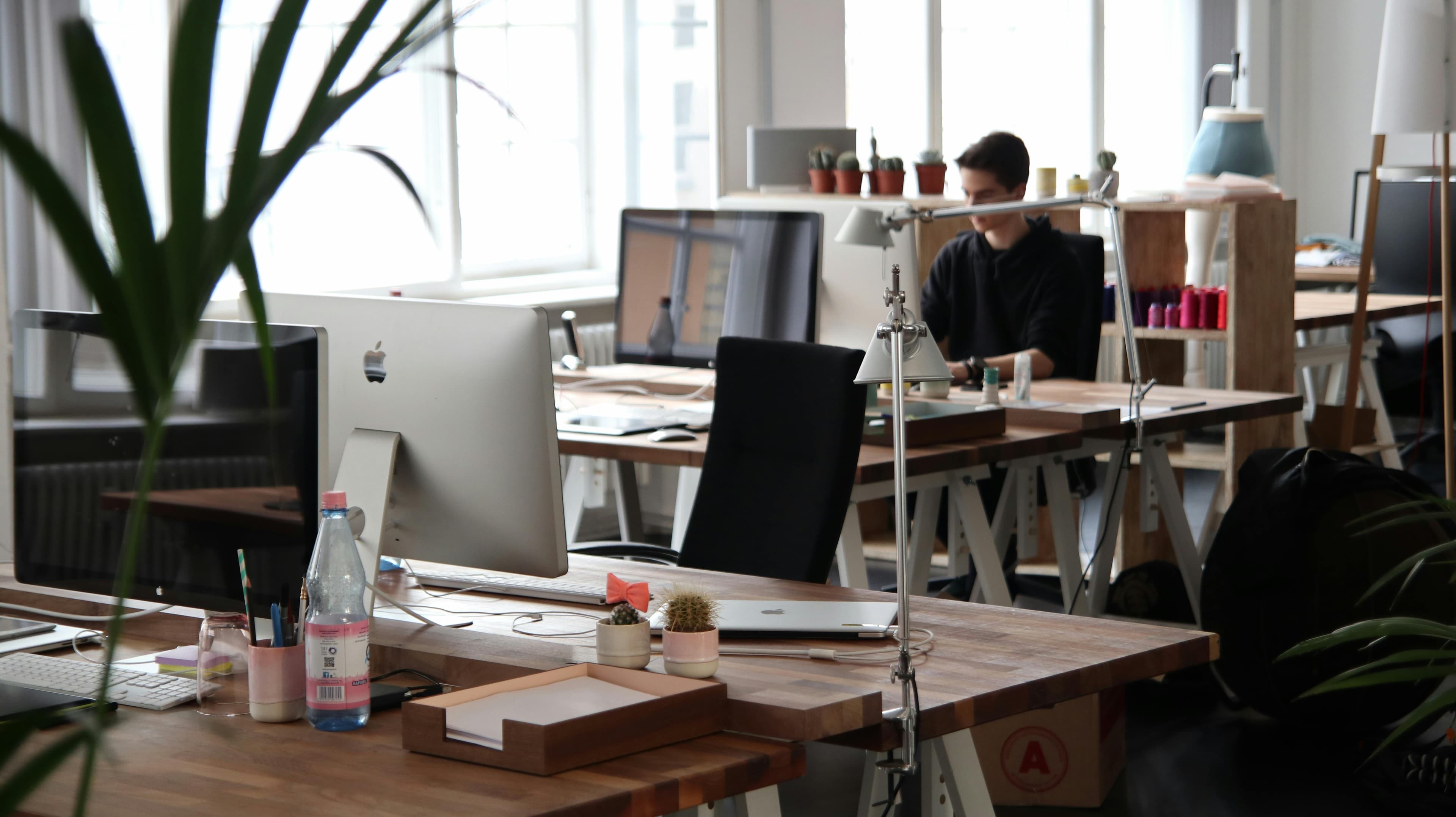 Pense adviser working in an office