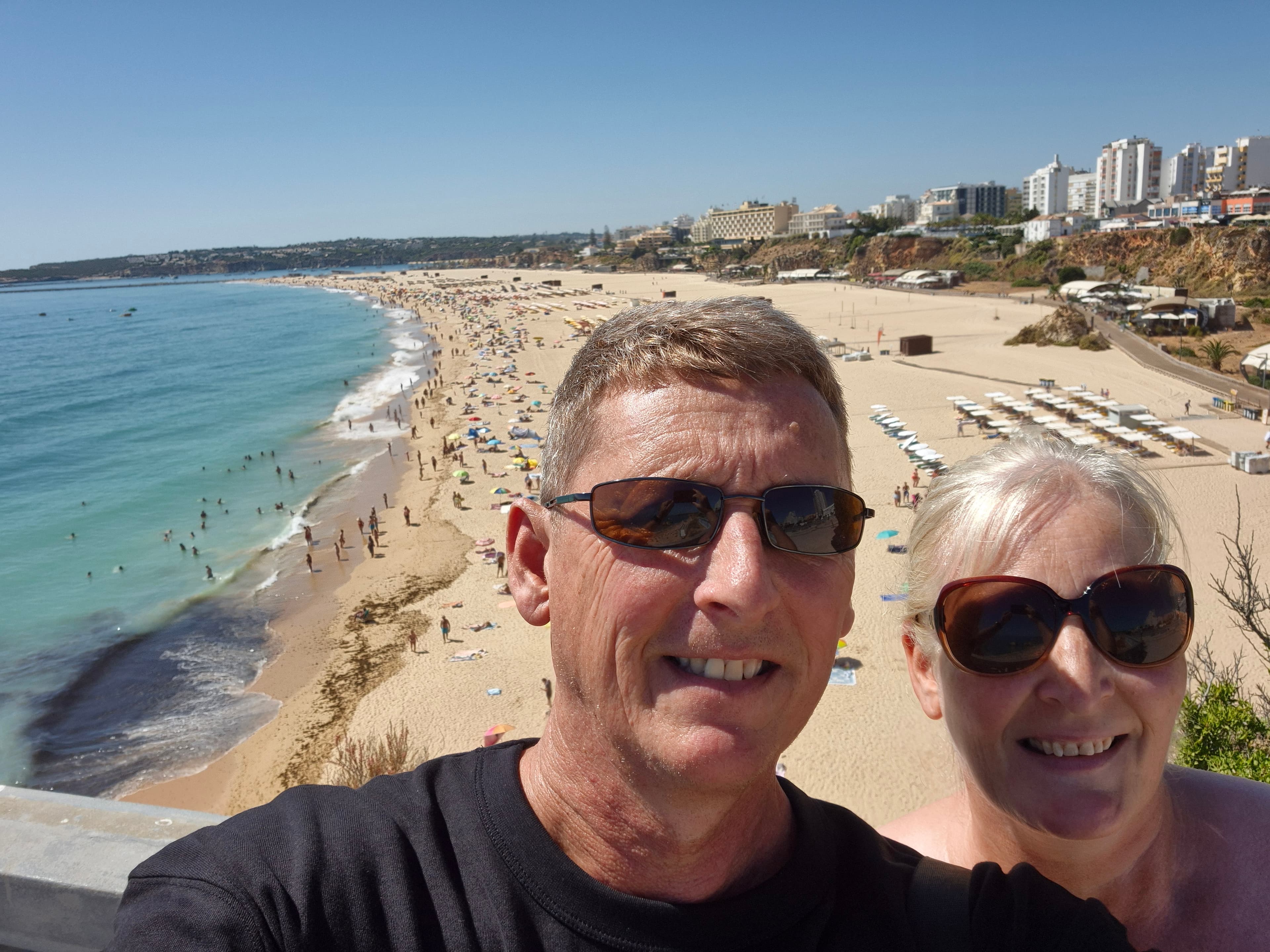 Paul and his wife overlooking a beach